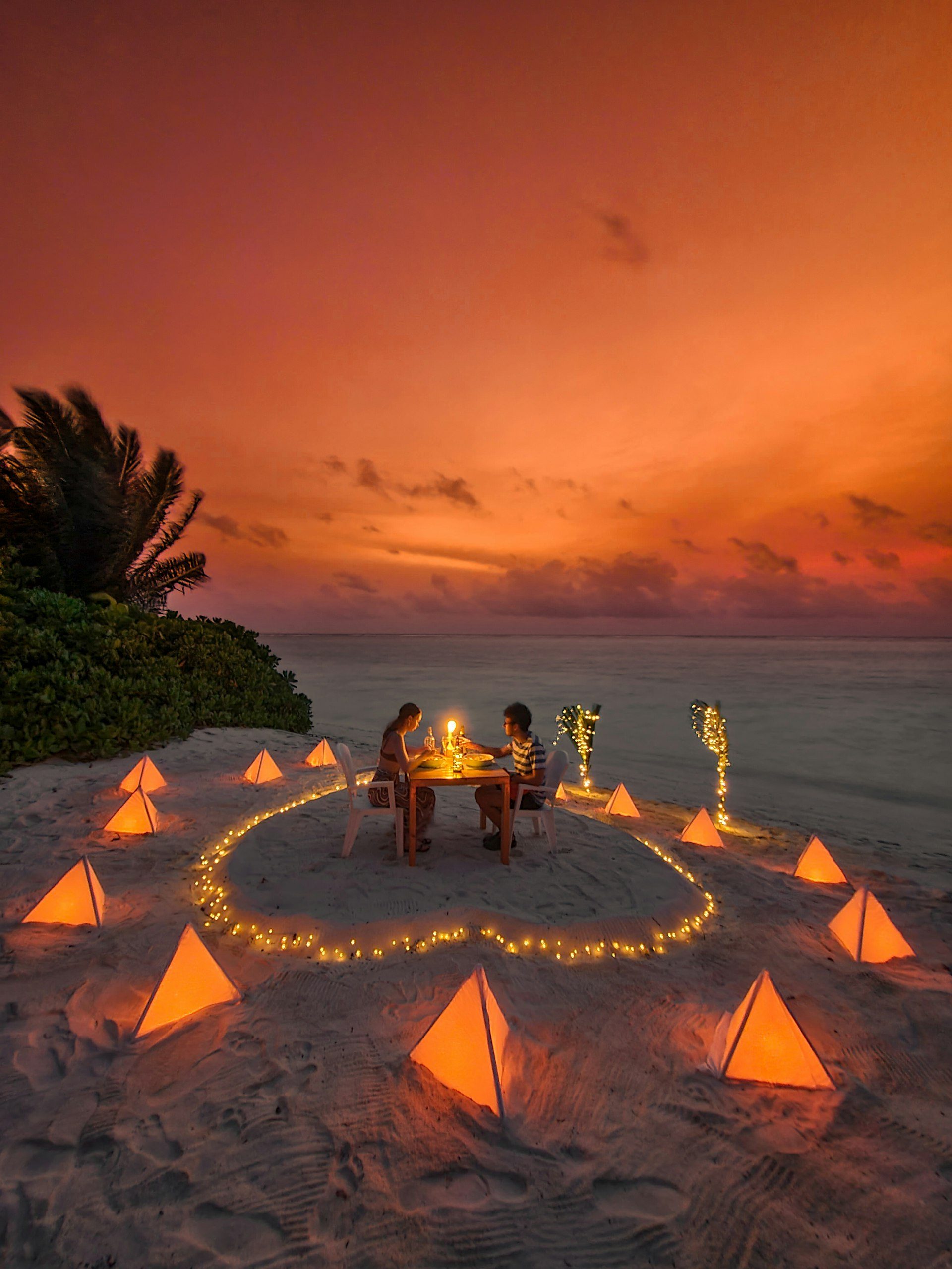 A private candlelit dinner for two at sunset