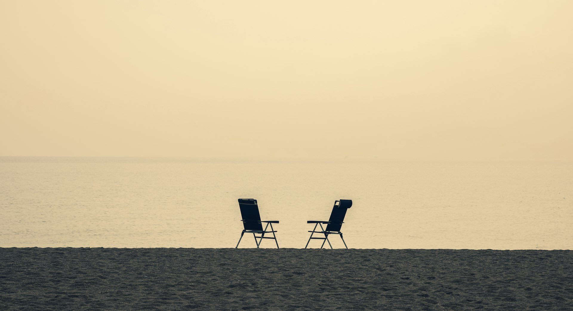 Two chairs facing the sunset