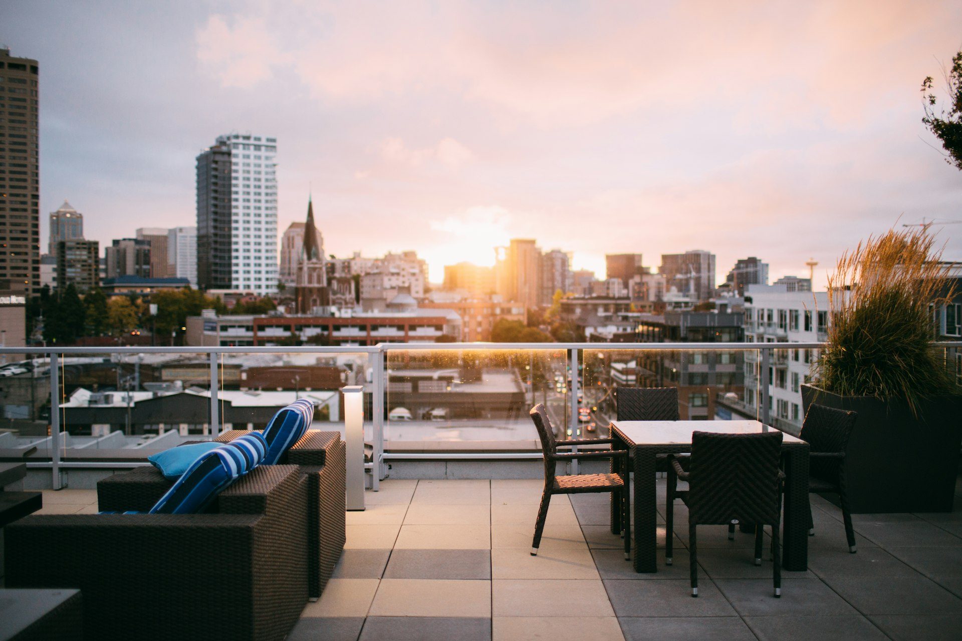 A rooftop above the skyline at dusk