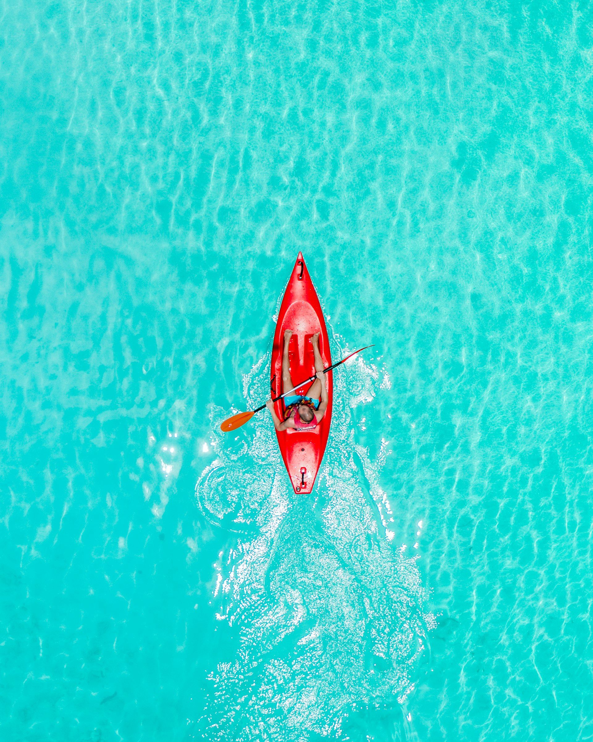 A kayak on a glass-clear lagoon