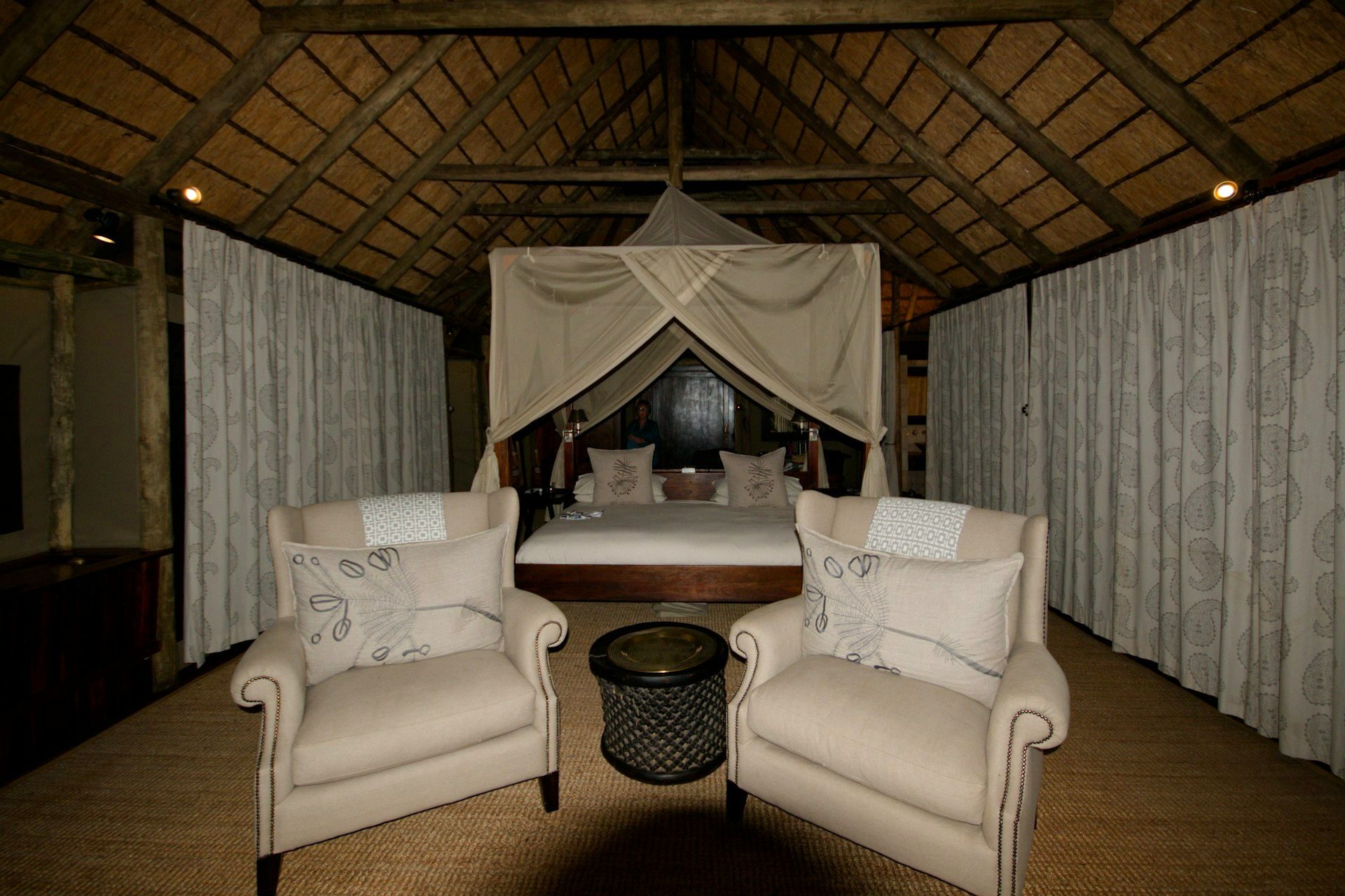 Inside a thatched safari lodge suite