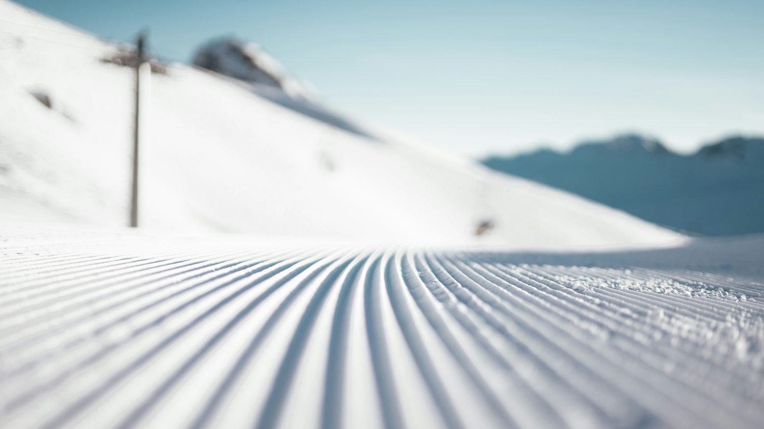 Zigzag ski tracks down a quiet slope